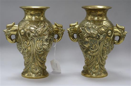 A pair of Chinese bronze dragon vases height 24cm